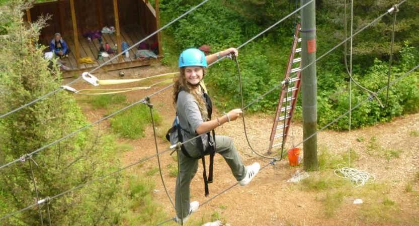 girls build confidence on ropes course